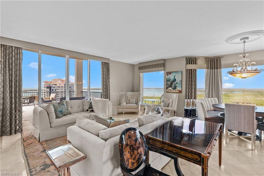 This luxurious two-story penthouse offers sweeping views of Estero Bay and the Gulf of Mexico. Polished marble tile flooring in a beautiful neutral tone creates a luxurious and timeless look. A custom-made curved staircase with wrought iron balusters adds a dramatic touch to the entryway. Soaring windows in the living room with a gas fireplace set the tone for entertaining. Subzero-built-in wine locker with temperature and humidity control to store and age your favorite wines. Top-of-the-line appliances, 6 burner gas range, and center island with additional dishwasher. Custom cabinets in the den, family room, library, upgraded lighting, laundry on both floors, and private enclosed 2-car garage with storage. Your most discerning buyers will fall in love. Palermo has 2 guest suites, a theater, billiards, a pool/spa, a BBQ pavilion, a fitness center,  front desk staff, and an on-site building manager. Residents of The Colony enjoy private membership to a waterfront dining facility, The Bay Club, with exceptional views with sunset dining/entertainment. Experience a full array of amenities such as kayaking, canoeing, sailing, bocce, tennis, pickleball, and the private beach park accessed by water taxi. 15 minutes to the airport.