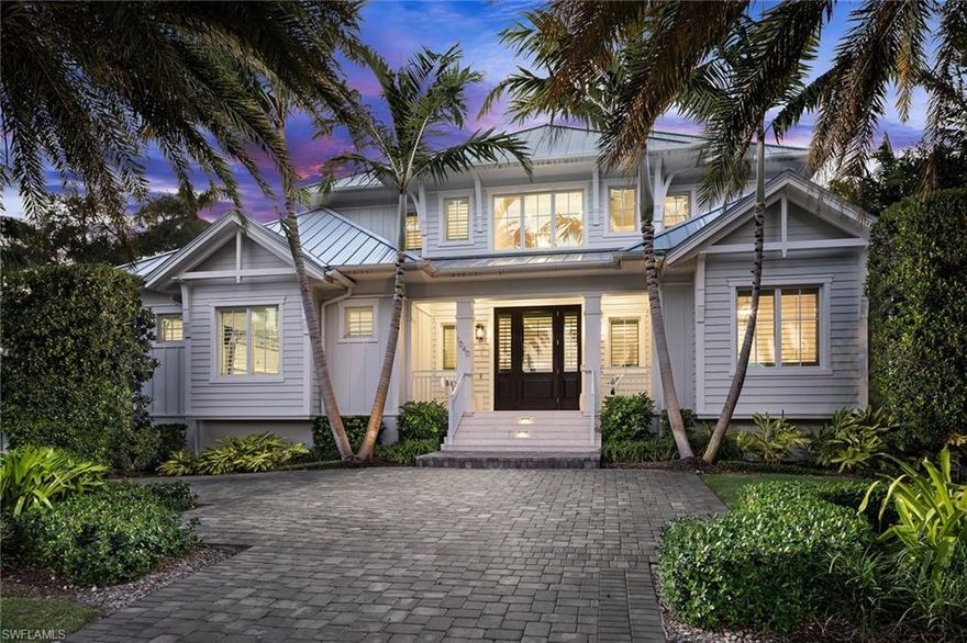 Exceptional Olde Florida-inspired residence built in 2020 by Griffin Builders and designed by MHK Architecture, just two blocks from the Gulf and near the shopping and dining of 3rd St. S. and 5th Ave. S. Offered furnished, this six-bedroom, six full and two half bath home showcases inviting coastal design throughout, with wide plank French Oak floors, soaring ceilings, custom millwork, and designer lighting. A glass-enclosed wine room opens to the great room, anchored by an elegant fireplace and flowing seamlessly into the show-stopping chef’s kitchen with dual islands, 60” Wolf range, dual Sub-Zero refrigerators, dual dishwashers, built-in coffee maker, dual sinks, and premium fixtures. The light-filled Florida room with an outdoor kitchen opens to a backyard oasis with resort-style pool, spa, deck jets, AstroTurf, lush landscaping, and a pool bath. The first floor includes the primary suite with spa-inspired bath and walk-in closet, plus an additional en-suite bedroom. Upstairs, accessible via private elevator or staircase, a versatile loft with wet bar and Pecky Cypress accents is surrounded by four en-suite bedrooms, perfect for entertaining, media, or casual living. Additional features include a temperature-controlled garage, impact-resistant glass, and 22KW generator. A rare opportunity to enjoy refined Olde Naples living within a short stroll of the Gulf and the city’s finest shopping and dining.