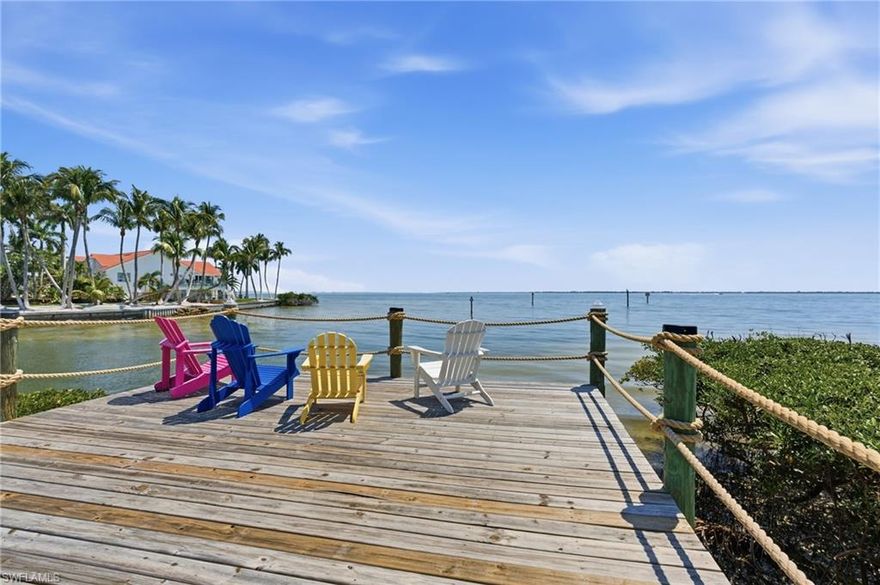 BAYFRONT!
Imagine ending your day with the sky stretching wide over San Carlos Bay, the lights of the Sanibel Bridge shimmering in the distance, and nothing but open water and gentle breeze in front of you. Life here feels calm, expansive, and deeply connected to the outdoors.
This home is perfect for someone who truly loves being on the water. Step outside to your deeded dock and 10,000 lb boat lift (with water and electric), ready for morning fishing runs, sunset cruises, or quick trips to Sanibel and Cayo Costa. You’ll enjoy fast access to the Intracoastal Waterway and deep-water Gulf access just minutes away.
From the living area and screened balcony, the bay becomes part of your daily rhythm — shifting light, passing birds, and the gentle movement of the tide. Zero-corner sliding glass doors open the main living space completely to the outdoors, while electric screens can be raised or lowered for comfort, creating a seamless indoor-outdoor experience. Just steps away, an observation area offers the perfect spot to relax or wade into the water.
Inside, the home is beautifully updated. The kitchen features premium appliances including a Bosch refrigerator and dishwasher, Wolf microwave and stove, a pot filler, and a stylish Kraus farmhouse sink.
The main living level includes an open living space, the primary suite, and an elevator that runs from the carport entry level directly to the main floor for everyday convenience. The primary suite offers a spa-like bath with a clawfoot soaking tub, walk-in shower, and large closet. Upstairs, you’ll find two additional bedrooms and a spacious bath with a custom walk-in shower.
The ground level provides valuable flex space with epoxy flooring and EnduraFlood panels — ideal for storage, hobbies, or a game room. Electric storm shutters add extra convenience and peace of mind.
This turnkey home is located in St. James Place, a beautifully landscaped community of just 20 residences featuring a heated pool and spa. Tucked away on the southern tip of Pine Island, this is more than a home — it’s a true waterfront lifestyle.
Come see how different everyday life can feel when the bay is right outside your door.