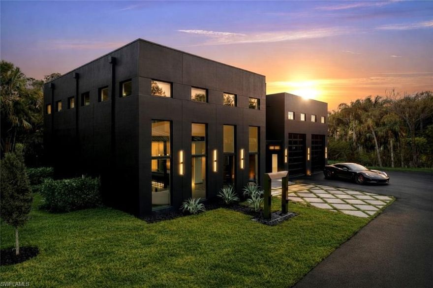 This isn’t coastal soft.
This is steel, concrete, wood, and glass. Volume. Texture. Intention.

This is not merely a house — it is the destination.

A triumph of design, craftsmanship, and architectural audacity, 27100 Imperial Parkway is a nearly 5,000-square-foot residence under air (over 7,000 total!) set on a private acre of natural preserve. Completed in 2026, this one-of-a-kind modern sanctuary fuses precision engineering with warm livability — bold yet refined, dramatic yet deeply intentional.

Imagine total privacy, buffered by nature, while remaining moments from world-class coastal dining, shopping, and entertainment. Secluded — but never disconnected. Upon arrival, a grand entrance with soaring 22-foot ceilings immediately establishes the scale. Natural light pours through expansive walls of glass, illuminating sculptural interiors defined by clean lines and curated materials. Two floating staircases — each step individually LED-illuminated — function as architectural art. Exposed steel beams add industrial edge, softened by warm woods and bespoke finishes. Designed for elevated entertaining, the chef’s kitchen features top-tier Viking appliances, custom cabinetry, and statement fixtures. A separate guest suite or executive office with it's own private entrance, private bath and sleek wet bar offers flexibility without compromise. Luxury is found in the details: solid-core doors, a designer lighting package, custom built-ins with integrated LED accents, and even a discreet laundry chute from the primary suite. Every element has been considered.

Then the walls disappear.

An entire expanse of glass opens to a private outdoor oasis where stone decking surrounds a striking pool and expansive covered terrace. The preserve beyond becomes living artwork — tranquil, protected, and ever-changing. Above it all, a rooftop deck offers the ultimate vantage point for sunset cocktails and stargazing.

Built with enduring quality, including all impact glass throughout, this residence is as structurally impressive as it is visually stunning.

For the automotive enthusiast, the property is nothing short of extraordinary. A massive driveway, elegant stainless steel water sculpture, and an enormous garage designed to astonish — featuring towering impact-glass doors and ceilings with unique hexagon LED lighting, designed to accommodate lifts, allowing the five-car garage to hold up to ten vehicles. Boaters and RV owners will find ample parking as well. 

Located just about a mile from Imperial 41 and Sugar Shack and a short drive to downtown Bonita, this architectural masterpiece offers rare proximity to convenience while preserving complete privacy.

Agent-accompanied showings by appointment only.
Experience a residence where design is deliberate, luxury is effortless, and living is elevated.