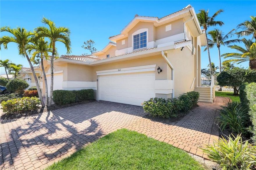 Wake up to tropical living at Coconut Shores where mature coconut palms and shimmering lakes create a true year round retreat. This established Estero community is known for its lush resort style design, generous residences and relaxed coastal atmosphere with a community pool, tennis and pickleball courts woven seamlessly into the landscape. This ground floor condominium offers no steps and an easy flowing layout with volume ceilings and abundant natural light. The spacious living and dining areas feature laminate wood flooring throughout the main living space. The dine in kitchen provides ample cabinetry and counter space and functions beautifully for everyday living or extended stays. The floor plan includes two bedrooms plus a den. The den offers built in cabinetry and a desk and enjoys lake views making it ideal for a home office or easily converted to a third bedroom as originally offered by the builder. Bedrooms are thoughtfully split for privacy. The primary suite overlooks the lake and palm island with western exposure sunsets as a daily backdrop. Dual walk in closets provide excellent storage and the refreshed primary bath features dual sinks, a separate shower and an oversized soaking tub. The guest bedroom is tucked along a private hallway with a full guest bath creating an almost ensuite feel. The tiled lanai has been enclosed with hurricane glass to create additional dry, dust free living space and serves as a natural extension of the interior while preserving lake and sunset views. Neutral coastal tones throughout create a comfortable move in ready feel. Indoor laundry and a two car garage add everyday convenience. Roll down storm shutters provide storm protection and peace of mind. This is the Areca floorplan. Coconut Shores is an active social community with Saturday morning coffee socials, excellent amenities and a prime location near shopping, dining and everyday conveniences at Coconut Point. Bonita Beach and Barefoot Beach are approximately twenty minutes away and RSW Southwest Florida International Airport is twenty to thirty minutes making this an ideal full time residence or easy fly in, fly out retreat.