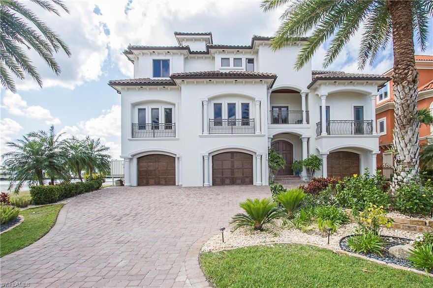 BEACH, BAY, BOATING... located in the coveted, three finger streets directly off of GULF SHORE DR., surrounded by lush landscape sits this Magnificent Waterfront Estate Home. Location... Location...directly off of GULF SHORE DR.-Across the street from Vanderbilt Beach (voted in the top 10 beaches 6 years running). This 5-bedroom Estate Home with spectacular BAY VIEWS extending to all rooms and ATTENTION TO DETAIL is sure to please your most discerning buyer. This luxurious gem has 5,860 square feet of living space, a spacious 4 car garage, an inviting large & open great room, sparkling infinity edge pool/spa, marble floors, high end Wolf/Subzero Appliances, office/exercise room Plus Deeded beach access .THIS HOME TRULY HAS IT ALL! When you are not enjoying your BAY VIEWS from your expansive balconies or lanai, take your boat out from your own dock with lift to the warm Gulf Waters, walk to enjoy fine dining at the Turtle Club, La Playa or shop at Mercato Center, sink your toes into the sugar sand at Vanderbilt Beach, plus only 30 minutes to airport.  Make your DREAM of a beach & boating lifestyle in this elegant yet easy living home COME TRUE! Must be seen to be appreciated!