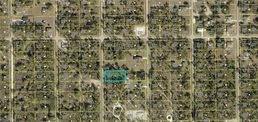 HALF ACRE residential building lot on a quiet low traffic street. Nicely paved street with larger estate sized homes in the area. Excellent location just minutes to SR 80, I-75 and Ft Myers.