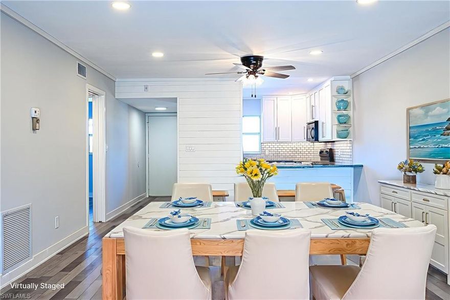 55+ community. Welcome to this beautifully remodeled 2 bed, 2 bath slice of paradise in Country Club Manor. Completely upgraded from top to bottom, the unit includes desirable features like crown molding throughout, shiplap paneling, recessed lighting, brand new A/C, patio storm shutters, and a private, tranquil patio view of vintage Naples nature. A carport is also deeded to the unit! Country Club Manor includes a common elevator and a community pool as well. The condo is just minutes away from classic Naples hallmarks like 5th Ave S and 3rd St, offering some of the finest dining and shopping selections in the region. Of course, you are also close to the white sugar sand, blue water beaches that make Naples famous. This condo is the ultimate opportunity to live in one of the most beautiful corners of the country… Naples, FL!!!