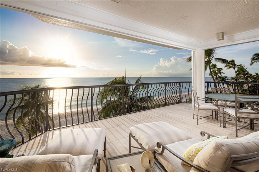 Sitting directly on the beach, this luxuriously renovated Via Delfino residence offers impressive sweeping 5th-floor Gulf views.  The stunning vista is captured from multiple terraces throughout the unit, beckoning you to the white sand beaches below.  Completely remodeled by Morton & Wasmer Builders, the interior reflects a transitional style featuring clean lines and high-end touches like stunning dark hardwood floors, custom cabinetry, and built-ins throughout, a bright white kitchen with quartzite counters, an island with seating, 2 Subzero fridge drawers, and a wet bar with wine fridge.  The master suite with its own breathtaking Gulf view has two large walk-in closets with built-ins and a spa-like bathroom.  Via Delfino is situated South of Doctor’s Pass and is a uniquely low-density community of only 24 units, 3 per floor.  Residents enjoy the crystal blue lap pool, poolside bar area, and convenient proximity to downtown Fifth Avenue South and Third Street South for world renowned shopping, fine dining and entertainment