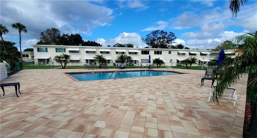 2 Bedroom Golfview condo in move-in condition and being sold furnished.  Well maintained unit with laminate floors in the living area and carpet in the bedrooms.   All kitchen appliances included.  Excellent views of the common area, pool and golf course, pavers surround the large pool area with plenty of deck space, covered and deeded carport parking space, common laundry room with storage closet for each unit. 55+ community, small pets allowed. Low monthly condo fee covers all exterior maintenance including the roof.  Not located in a flood zone.