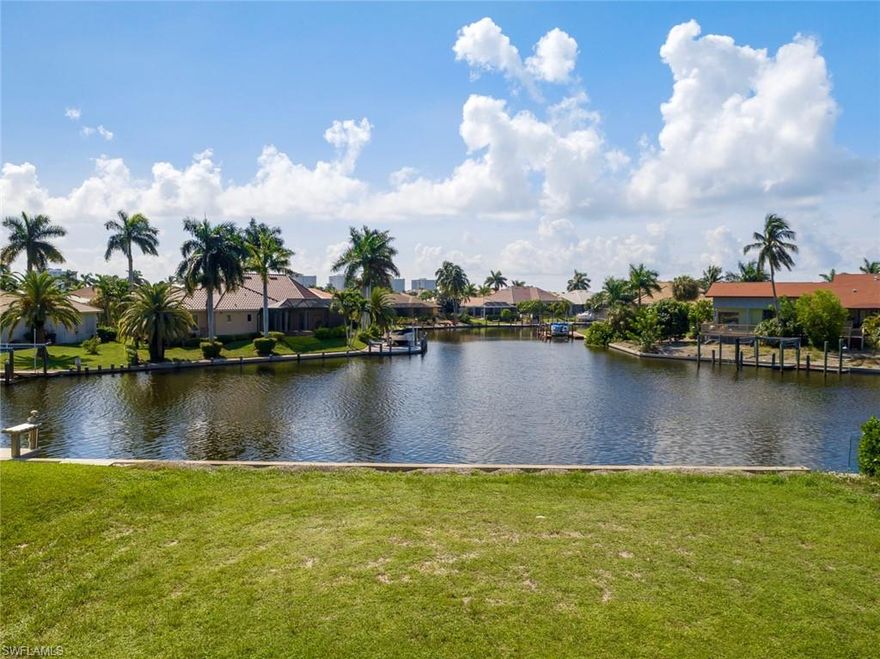 Panoramic Wide Water Views & Sunsets from your new home site. Area of fine homes. Newer seawall. Quick access to the Gulf and off-island beaches.