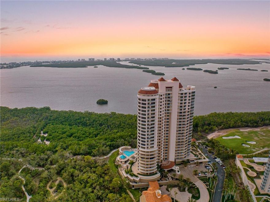 Enjoy a commanding vantage point above Estero Bay with sweeping views to the Gulf beyond from Azure 2301. Originally configured as three bedrooms plus a den with three-and-a-half baths, extensive renovations in 2015 transformed the formal living room into an additional den or office, enhancing both functionality and flexibility. Notable custom enhancements include a striking wine cellar and beautifully updated bespoke woodworking in the dining and living areas. The residence includes a deeded, oversized private enclosed two-car garage with space for additional recreational equipment. A private elevator lobby with secured elevator entry ensures exclusivity and privacy.
The gourmet kitchen is thoughtfully appointed with a Wolf gas cooktop, Sub-Zero refrigerator, Wolf double wall ovens, and dual U-Line refrigerator drawers for convenient, flexible cold storage. The spacious balcony features a gas grill, ideal for outdoor entertaining while enjoying the exceptional views. Residents of Bonita Bay Community Association enjoy access to a private marina with Backwater Jack’s restaurant, a newly reconstructed private community beach facility and 8 community pickleball courts slated to open March 2026. Optional membership to Bonita Bay Club offers an unparalleled lifestyle with multiple on-site dining venues, five world-class golf courses, 16 tennis courts, and 15 pickleball courts. The Lifestyle Center—nearly 20,000 square feet dedicated to fitness, health, and spa services—completes this exceptional offering.
