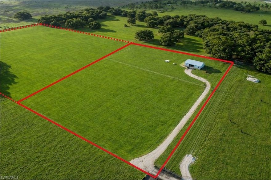 Secluded and full of potential, this beautiful 10-acre tract offers the perfect opportunity to create your ideal country lifestyle. Whether you envision a custom BARNDOMINIUM, small farm, or private rural retreat, this property is already well on its way.

Originally started as a pole barn, the existing structure is constructed on an 8-inch slab, providing a strong foundation for future completion. The unfinished building already features a durable metal Galvalume roof and hurricane-impact windows. With county permitting, it can be finished to suit your needs as a custom home, BARNDOMINIUM, barn, or workshop.

The land is fully fenced and currently supports cattle, with an agricultural exemption already in place to help keep property taxes low. A 3-inch well is installed and set up for solar power, with only a submersible pump needed to provide water to a future residence or barn. There is also a holding tank for an RV, allowing you to stay on-site while completing construction or managing agricultural use.

Ideally located in LaBelle and close to Alva, the property offers peaceful country living with convenient access to rural LaBelle and downtown Fort Myers. Located only about 5± miles from the Lee/Hendry County line, it provides easy access to schools, shopping, and commuting routes.

Visible scattered oak trees and improved pasture create a picturesque Old Florida setting that is both usable and inviting. If you have been searching for acreage with existing improvements, agricultural use, and endless potential, this is an exceptional opportunity.

Adjoining 10 acres also available: ML# 2026017669.