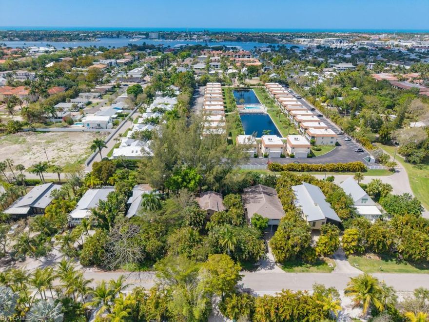 LOCATION, LOCATION, LOCATION!
No HOA and ideally situated just minutes from Tin City, downtown Naples, and the vibrant shops and dining of 5th Avenue. Enjoy a short drive to the Naples white sand beaches, making this home the perfect blend of convenience and coastal living.
This charming 2-bedroom, 2-bath residence is tucked away in a lush, tropical setting reminiscent of the Florida Keys, offering both privacy and character. 
A large screened lanai with soaring cathedral ceilings extends off the main living area, creating the perfect space to unwind or host guests while embracing the Naples lifestyle.
Inside, you’ll find an updated kitchen and bathrooms, beautiful hardwood flooring, and the added peace of mind of a new air conditioning system installed in 2024.
The first floor features a versatile non-conforming flex space with abundant storage—perfect for a boat, workshop, hobbies, or whatever suits your lifestyle.
Ideal for investors seeking a strong rental opportunity or for buyers looking for a full-time residence or vacation retreat, this property offers flexibility and appeal.
THIS IS A MUST SEE!!