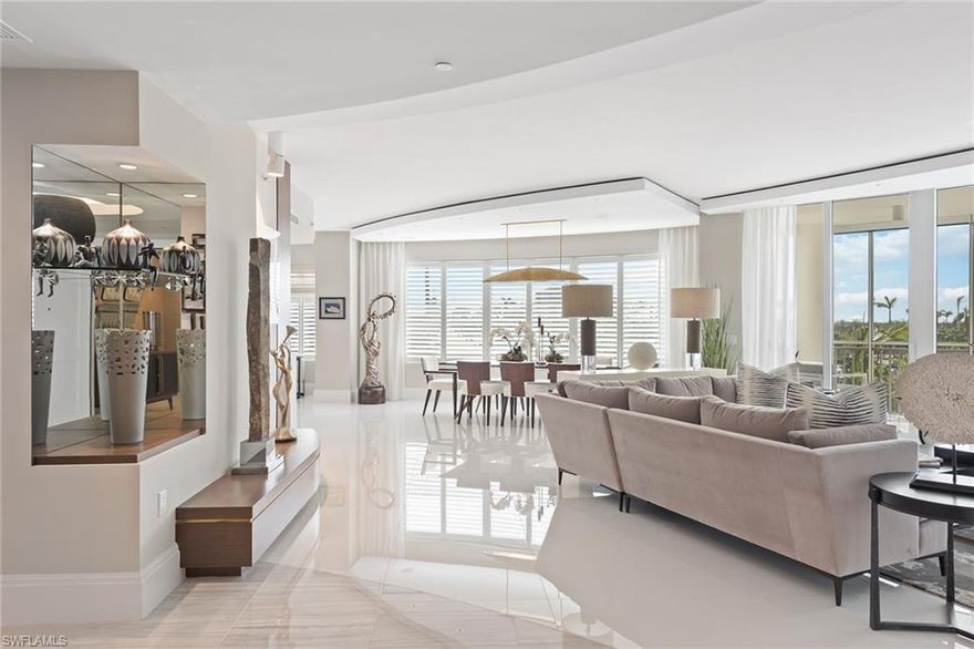 Expect to be impressed! This former model is extraordinary with gracious custom details throughout, translating into elegant interiors. This home is being offered with furnishings negotiable. The private elevator opens to a dramatic living area featuring white marble flooring, a linear fireplace and tranquil views of the yacht harbor and private marina. The epicurean kitchen with stunning quartz countertops includes top-of-the-line Wolf appliances, gas cooktop, Miele dishwasher, Sub-Zero refrigerator and wine cooler. The primary bedroom boasts wide-plank wood floors, a custom-designed closet and an elegant spacious spa-like bath. This home also offers a spacious, private office. Each guest bedroom with en-suite provides a tranquil, private retreat. Aqua offers residents an amenity-rich lifestyle including on-site concierge service, fitness center, virtual game center, theatre, putting green, dog run, social rooms, three guest suites, two parking spaces and more. *** (See information about a membership opportunity to Pelican Isle Yacht Club and Beach Access in the Confidential Information below).