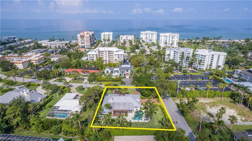 This spectacular property in the heart of Naples offers a rare lifestyle opportunity nestled just blocks from the celebrated beaches of Naples, Florida and within a short distance to the internationally recognized cultural district of "Fifth Avenue South," and “Third Street South”. This charming residence, has been completely updated and includes a modern kitchen with wood flooring. The great room concept features a chef's kitchen that opens to the dining and living space and is perfect for entertaining.  The expansive outdoor living space features a large pool and separate private spa.  Home is move-in ready and a “must see”!