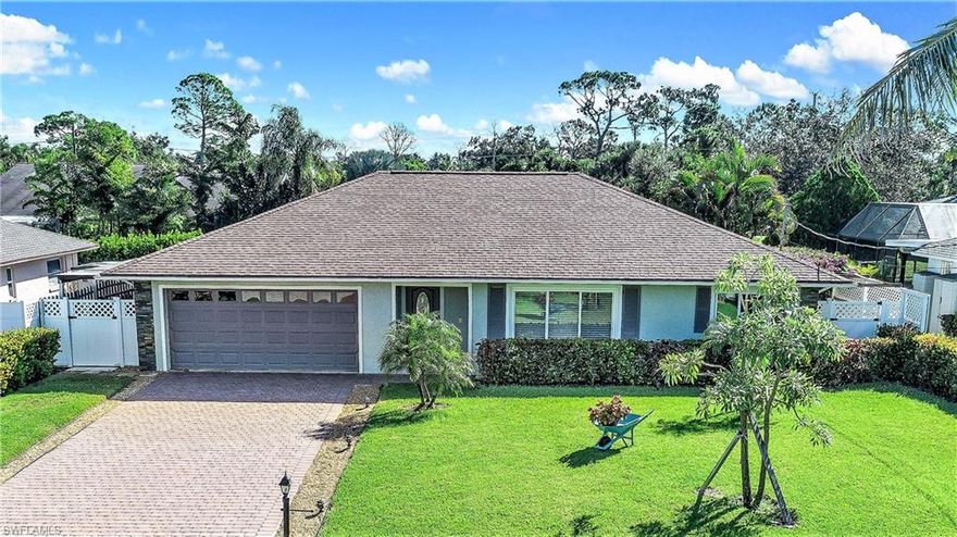 The BEST PRICED Updated Home on the Water in Bonita & Naples -Great Location - tile throughout, showers, baths, kitchen all professionally updated to perfection.  AC 2015, Water heater 2014, new windows this is  A MUST SEE pool home with easy access to Imperial River, Estero Bay and the Gulf of Mexico. Sliding glass doors off master bedroom, dining, and guest bedroom lead to covered Trek deck area and to screened lanai with pool. Garage holds 2 cars with super clean epoxy finish home has nice long and wide paver driveway. Superbly landscaped with an incredible lawn that is completely fenced. Best value for a two car garage pool home on the water and being offered TURNKEY. No HOA!! FULL ONE YEAR WARRANTY - Ready for your boat, kayaks, fishing rods.