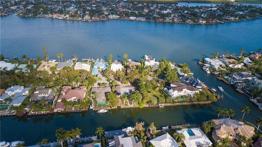 With it's Western exposure overlooking the water, an exceptional view of the nightly sunset, is yours. 
Located near the end of a quiet, peaceful cul-de-sac in Auqalane Shores, this location of both luxurious and peaceful surroundings make it a bit easier to fully embrace what the Florida lifestyle is all about!
Enjoy a bike ride to the Naples pier as well as nearby shops, eateries, galleries and pubs. Take the boat out for an afternoon of fishing, or an evening out for drinks and dinner, accessible by water.
Come and see why the ambiance in this particular part of Naples is the perfect canvas to paint your dream home on!