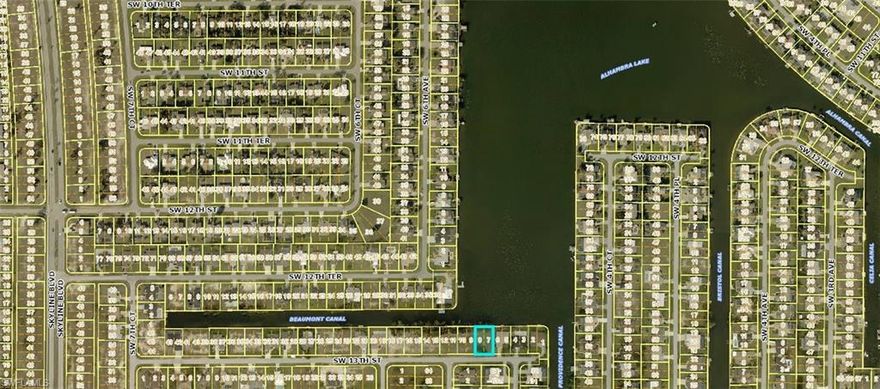 Welcome to an exceptional opportunity to build your custom dream home on the highly desirable South Shore of Lake Alhambra. This premier waterfront homesite offers breathtaking panoramic lake views and direct access to miles of navigable waterways, placing you at the heart of Cape Coral’s renowned chain-of-lakes system.

From your backyard, set sail through interconnected waterways that lead to Lake Kennedy, Lake Saratoga, Shamrock Lake, and numerous other lakes—perfect for boating, kayaking, fishing, and sunset cruises. Whether you’re an avid boater or simply enjoy tranquil waterfront living, this location delivers the ideal balance of recreation and relaxation.

Nature lovers will appreciate the daily wildlife encounters, from osprey diving for fish to playful otters and graceful turtles gliding through the water, creating a serene and picturesque setting right outside your door.

Adding to the value, all assessments are fully paid, offering peace of mind and simplifying the path to construction. Ideally situated, this property provides quick access to Cape Coral’s top dining, shopping, entertainment, and outdoor recreation, while still maintaining a quiet, residential feel.

Opportunities like this are rare—secure your place on one of Cape Coral’s most sought-after lakefront locations and start envisioning the waterfront lifestyle you’ve been dreaming of. Don’t wait—this one won’t last.