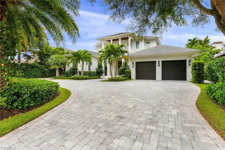 Enjoy breathtaking bay views from this spectacular Park Shore home.  2018 build with over 100 ft of water frontage. Expansive open floor plan featuring great room, high intricate ceilings, gorgeous built ins, gourmet kitchen with large island and butler's pantry, wet bar, large dining area, fabulous climate-controlled walk-in wine room.  Large, pocketing impact doors lead to dream outdoor area with seating areas, outdoor kitchen, negative edge pool and spa, pool bath, fire pit and added dock with lift.  Glass panel fencing surrounds to showcase the panoramic water views.  Designer lighting and enhancements completed throughout.  Main floor primary suite, adjacent den overlooking the water plus one main floor guest suite.  The second level features two additional guest suites, waterfront balcony, loft lounge and office nook.  Laundry located on both levels.  Circular paver drive with 3 car garage.