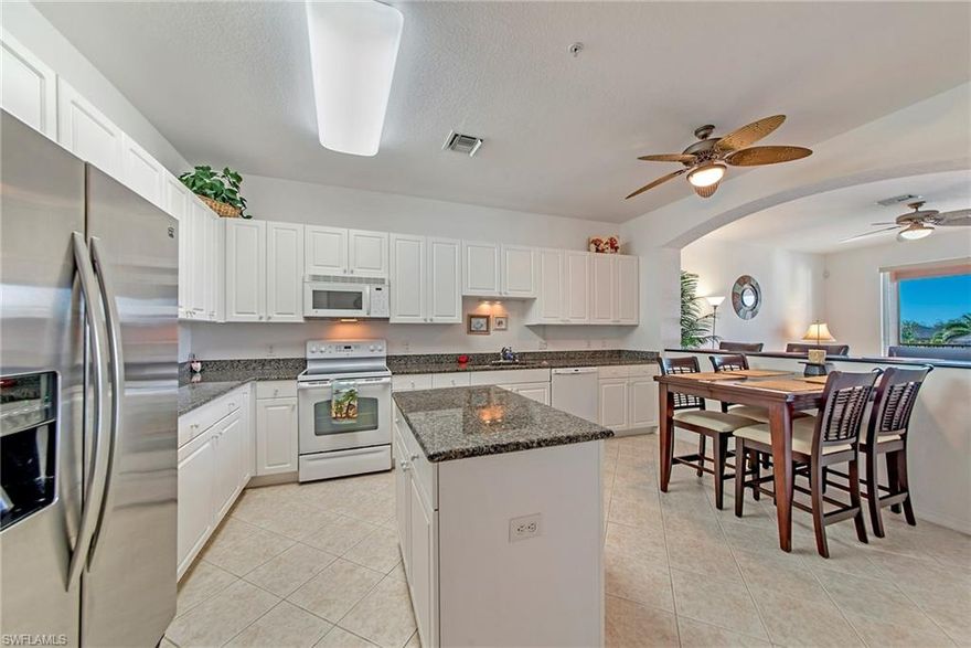 Offered beautifully furnished. Immaculate, over-sized water view condo in a manned-gated community.                 2 Bedroom + Separate Den with french doors + 2 Full Baths. Kitchen has granite counter tops, plenty of workspace, newer stainless steel refrigerator & built-in bar area. 
Master bedroom with sliders to the outdoors, huge master bath with dual sinks, soaking tub, separate shower & enormous walk-in closet. 
Split 2nd bedroom near private bath. 
Private outside storage room that is large enough to store bicycles, luggage, etc.  Covered parking space included and plenty of guest parking.          
LOCATION, LOCATION, LOCATION - easy access to US 41 & I-75. ONLY 3 miles to Barefoot and Bonita Beaches!  Beautifully tiled western exposure lanai with spectacular sunsets. 
Priced way below market value. Act NOW--Must see to believe!!