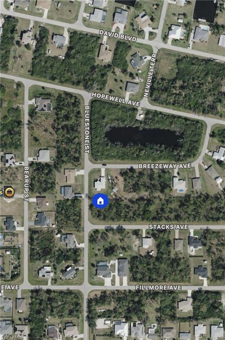 Excellent opportunity to buy buildable corner lot in Port Charlotte. Other homes on the street.