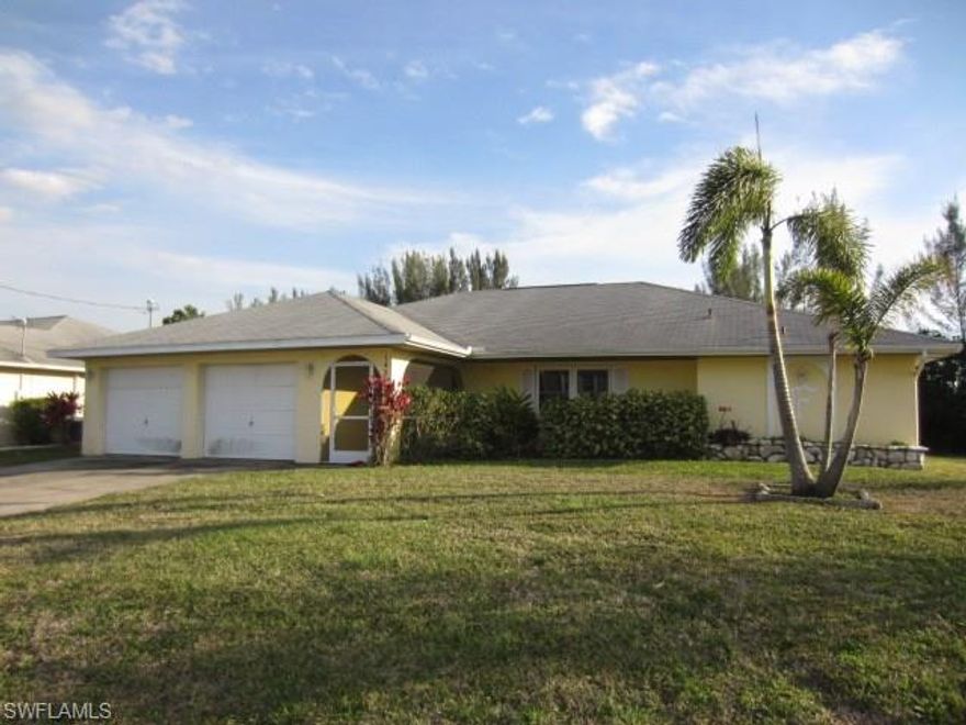 AWESOME WATERFRONT 3BR/2BA Home in Central Cape Coral. Exterior features oversized lot with large backyard and boat dock for your Florida lifestyle enjoyment! Interior shows spacious living/dining area, galley style kitchen with extra counter area and pass-thru window to tiled lanai area and  Family Room with Fireplace!
All Baths have dual sinks, all Bedrooms feature walk-in closets and windows/patio doors have been upgraded for energy efficiency! Don't delay-Schedule a showing TODAY!