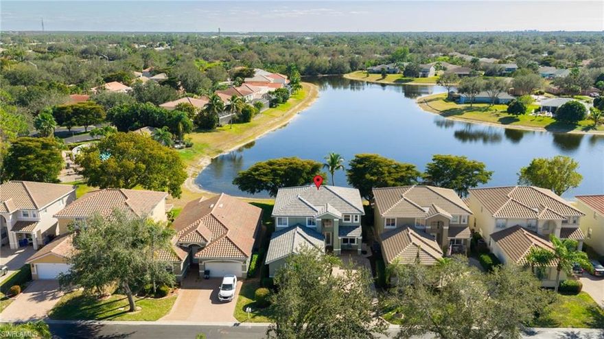 Introducing a spectacular, immaculate, nearly 2,800-sqft home on an incredible southern exposure long lake view lot in the desirable Timber Lake at Three Oaks, which includes a community pool and playground just a one-minute walk away. Enjoy plenty of space with four bedrooms plus a loft, three full bathrooms, and a massive three-car garage. The first floor opens to soaring ceilings with a bedroom and bathroom, large living room, family room, spacious updated kitchen, separate laundry room, and a mud room that can be used as a butler's pantry. The second story provides incredible long-lake views from large windows across the back of the home. Here you'll find the loft, two spare bedrooms with a full bathroom, and a separate master suite complete with two custom-built closets, dual sinks, a water closet, and a separate shower and tub. Throughout the home you'll find tasteful updates and improvements, custom built-ins and trim work, fresh paint, light fixtures, fans, and more. The attached three-car garage offers plenty of room for vehicles with included built-in storage and work space. Outside, enjoy a roomy covered paver lanai with additional uncovered screened space, an above-ground spa, mature landscaping, and stunning southern-exposure views over the longest part of the lake. Timber Lake at Three Oaks offers a community pool and playground, and is centrally located near the intersections of Alico Road, Three Oaks Pkwy, and I-75, just minutes from RSW International Airport, Gulf Coast Town Center, Hertz Arena, Miromar Outlets, University Village, and Florida Gulf Coast University. Don't miss this rare opportunity, schedule your private showing today!