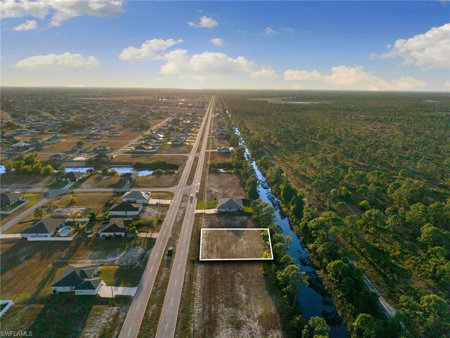 Exceptional opportunity to own a cleared residential parcel in the growing community of Cape Coral. This approximately 10,018 sq ft (0.23 acre) lot offers a regular, buildable footprint with canal frontage, providing the potential for water views and access in a thriving Southwest Florida market.Located in a desirable area east of Chiquita Boulevard and within easy reach of major roads, shopping, dining, schools, and city amenities, this property presents an ideal canvas for your custom dream home or long-term investment. Utilities such as electric, cable, and phone are available, and the lot is situated on a public paved road for convenient access.Whether you’re building now or holding for future appreciation, don’t miss this rare vacant land opportunity in one of Cape Coral’s expanding neighborhoods. Perfect for investors and builders alike!  ?