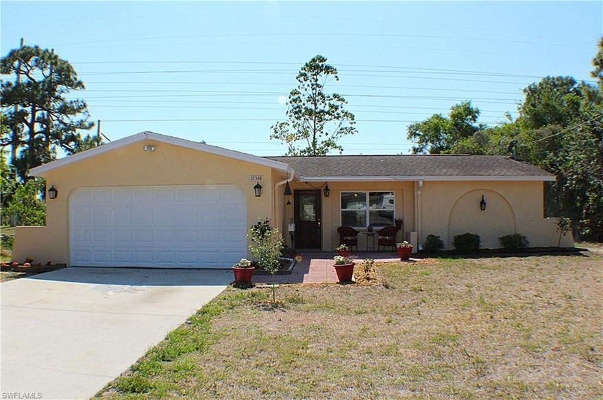 Please show for backup - Offer is shaky! Well loved and cared for 3 bedroom, 2 bath, 1-story home in great Bonita location with NO HOA FEES. Wonderfully situated on nearly an acre with western exposure, this home features an open floor plan, several recent updates including gorgeous guest bath and open kitchen with stainless appliances and under cabinet lighting, fenced yard with 3 separate double gates, and dual metered irrigation/potable water meter. Two sets of french doors lead from the living area to the large covered lanai overlooking the private yard featuring a garden shed, fruit trees, and highlighted by a stunning Rainbow Eucalyptus tree that you will fall instantly in love with. Hot water heater only 2 years old. Brand new carpeting in the bedrooms. Open living and dining room features gleaming wood laminate flooring. Best of all, there are no deed restrictions in this community and with no HOA fees, this is the place you will enjoy calling home!