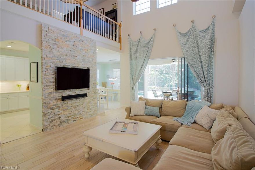 This completely updated single family pool home is bright and open with a coastal feel. Located in the desirable gated community of Delasol, this home features a first floor master bedroom and guest bedroom with two bedrooms and a loft on the second floor. 

Enjoy wood grain tile throughout the first floor, an accented stone wall in the living room, and a fully updated kitchen with quartz counter-tops and stainless steel appliances. The master bathroom has matching quartz counter-tops and features a honed marble shower with a frameless glass shower door. The upstairs features wood floors throughout the loft and hallway, and brand new carpet in both upstairs bedrooms. The pool is a custom salt water pool with a water feature, set within a large screened lanai.   

Delasol is a private gated community located in North Naples, favored for its size and family appeal. The community sits on 147 acres with only 271 single family homes and lush preserves, lakes, and common areas. The community clubhouse features a heated pool, spa, fitness center, and tennis and basketball courts.