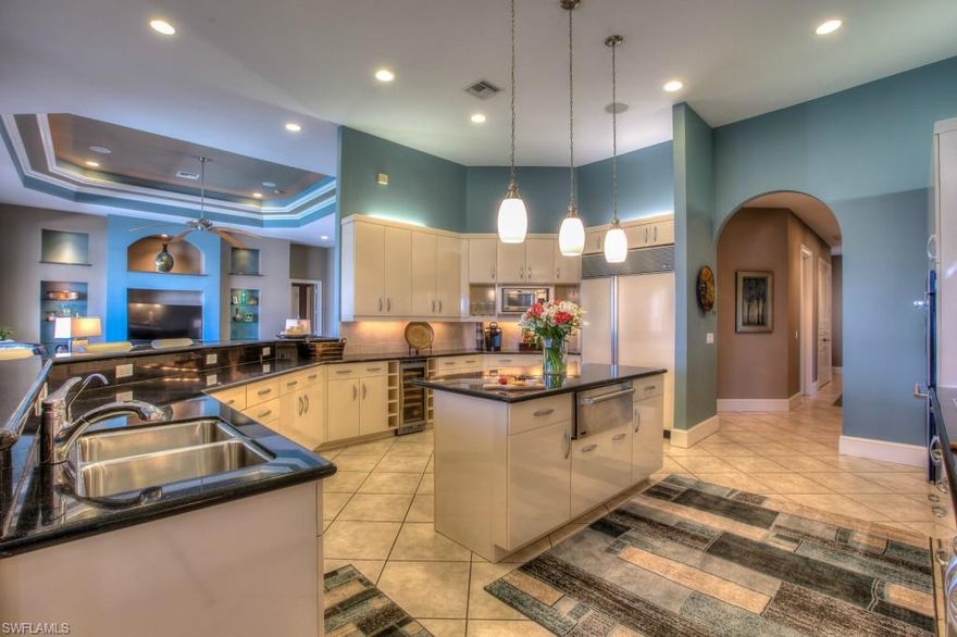 It's all about the VIEW at this lakefront estate home in the magnificent Miromar Lakes! From the moment you walk in the front door your eyes are drawn past the beautiful great room, through the pocket glass sliders, a quick stop at the lovely lanai with pool and spa, and then onto the piece de resistance...the coveted wide lake views of Lake Como and the stunning Miromar Lakes' amenities. This unique home has tremendous views from several of its rooms including the master suite, great room, kitchen and dining area, and large den. It also features 28 speakers throughout the home and outdoor space, an expansive floating private dock, the largest lake frontage lot in Miromar Lakes at 240 ft., and it has been newly and beautifully furnished! The gourmet kitchen features unique fiberglass cabinetry, professional grade appliances, and tons of storage. New paint and flooring in the guest rooms and den make this home sparkle. As if this space and the views aren't tremendous enough, there is also room to expand the home and really customize it to your needs. It’s ready for its next loving owner to enjoy the surrounding beauty that is Miromar Lakes!