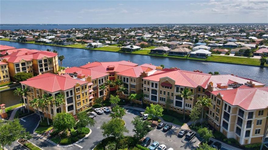 Welcome to effortless Florida living in this beautifully furnished top-floor (4th level) 2-bedroom, 2-bathroom condo with convenient elevator access and a first-floor garage. Filled with natural light, this thoughtfully designed home features a stunning stone accent wall in the living room and updated granite countertops in both the kitchen and bathrooms for a cohesive, upscale feel. The spacious layout includes a second bedroom with two full-size beds and a private en-suite bathroom with dual access; perfect for all your entertainment and guest needs. Enjoy indoor-outdoor living on the lanai with an electronic hurricane shade for added comfort and peace of mind. Additional updates include new carpet (2023), HVAC (2022), water heater (2020), comfort-height toilets, and a new metal roof. Located in a vibrant, resort-style community, residents enjoy a resort pool, lap pool, fitness center with classes, spa services, saunas, tennis courts, and a full calendar of social activities, along with game rooms, library, grills, and gathering spaces. Furnished and move-in ready, this home offers the perfect blend of comfort, style, and lifestyle.