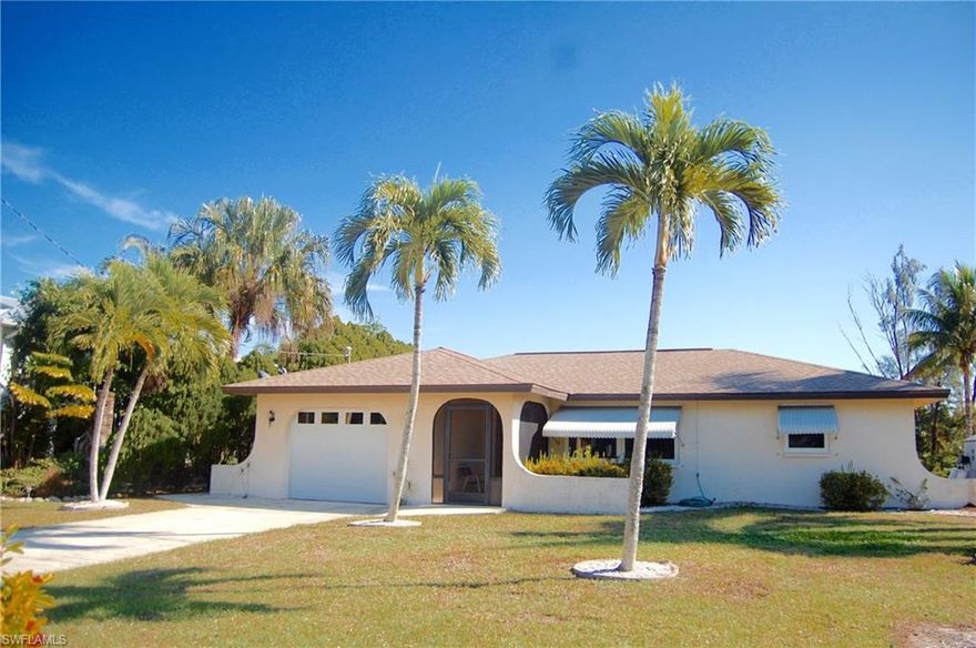 Beautifully maintained 3 bedroom 2 bathroom gulf access home. Nice split floor plan with eat-in kitchen. The screened lanai overlooks the expansive lawn to the dock and covered boat lift. All windows and sliding glass doors are recently installed hurricane impact. New A/C in 2010. Wood laminate floors were installed in 2015.
