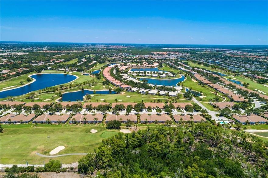 Stunning 3 bedroom 2 bath Twin Villa with an extended lanai & exceptional first class upgrades, with the best long lake view at Heritage Greens Community. This home boasts of numerous upgrades to include hard wood floors, oversize ceramic floor tiles, plantation shutters, designer ceiling fans and lighting, Hunter Douglas electric automatic vertical blind, designer curtains, & the master bath has a shower and oversize soak tub. This home is truly move in condition and shows like a model