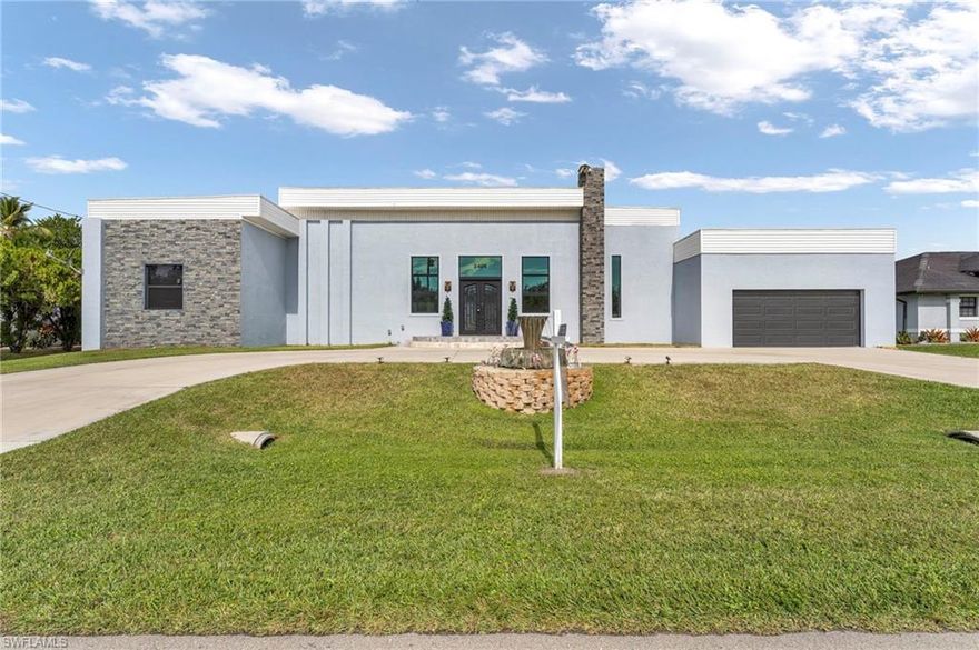 This stunning 3-bedroom, 3-bath contemporary Gulf access home offers over 3,000 square feet of living space under air, expansive canal views, and outstanding boating ride to the Gulf of America, making this property an ideal retreat for boating enthusiasts. Built in 2023, the home showcases a striking blend of industrial-modern design and European-inspired finishes, creating an inviting atmosphere that feels both open and comfortable. Dramatic 16-foot ceilings, wide doorways, and an open-concept layout allow natural light to pour in while enhancing ease of movement and everyday livability. Each of the three generously sized bedrooms features a private en-suite bathroom, offering comfort and flexibility for guests or multigenerational living. The bathrooms are elegantly appointed with easy-entry walk-in showers, floating vanities, and floating toilets, all thoughtfully designed within a handicap-accessible, barrier-free layout. The kitchen serves as both a focal point and functional workspace, featuring quartz countertops, stainless steel appliances, a Forno oven, a Zephyr vent hood, and clean, modern finishes. Mitsubishi multi-zone mini-split systems throughout the home provide quiet, energy-efficient climate control with individual room settings. Outdoor living truly shines with an expansive lanai accented by a tongue-and-groove pine ceiling, oversized fans, a rustic Italian-style grill, and a convenient outdoor sink and prep area—perfect for entertaining or simply relaxing waterfront. Located on intersecting Gulf access canals with a concrete seawall, this exceptional waterfront residence combines modern design, comfort, and the ultimate Florida boating lifestyle in one thoughtfully crafted package. Step inside and feel the difference—schedule your private tour and discover the ultimate Florida boating lifestyle.