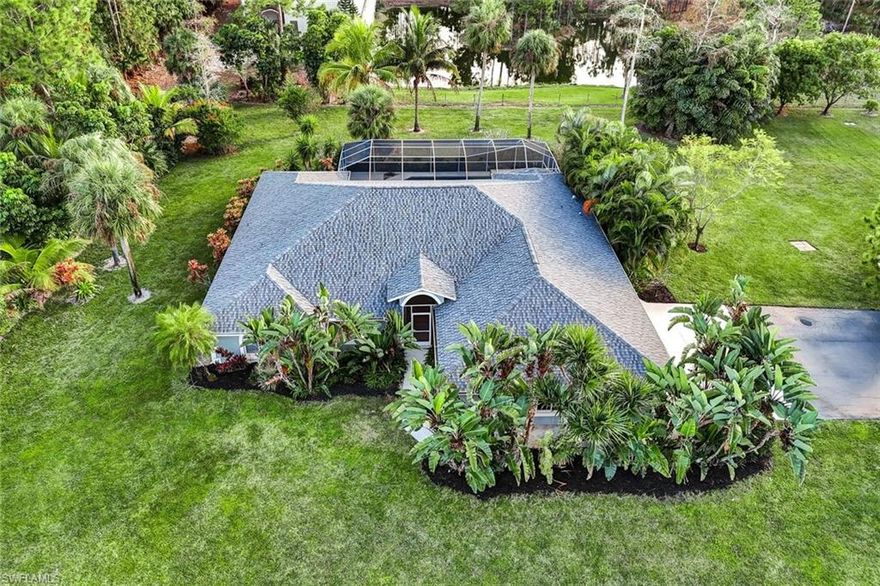 Discover a rare opportunity to own five acres in Golden Gate Estates, fully fenced with gated entrances and highlighted by a picturesque pond with fish, offering a peaceful natural backdrop. The property is not fully cleared, providing a beautiful blend of mature trees, fruit trees, and usable land, while maintaining privacy and character. Irrigation is supplied by a well and services the property from the pond area toward the street.

The main residence offers three bedrooms, two and a half baths, and a generous living area. The entire interior was freshly repainted, and new kitchen appliances installed. All light bulbs have recently been replaced to enhance the interior lighting.

Outdoor living includes a screened pool and spa, ideal for relaxing or entertaining. Additional features include an oversized three-car garage, a paved driveway, and an existing home security system.

A major highlight is the approximately 5,000 square foot metal building with electric and water already in place. The structure includes two rooms (one drywall and another wood frame). An HVAC unit is present but not connected, allowing flexibility for future use. The property benefits from two separate gated driveways, one serving the main residence and one dedicated to the additional building.

This versatile estate combines acreage, privacy, natural beauty, and functionality, making it well suited for a variety of residential and lifestyle needs in Golden Gate Estates.