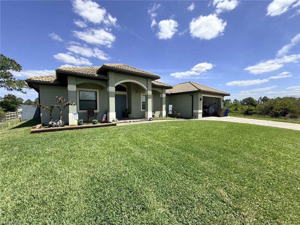 Photo of 1210 Plumosa AVE, LEHIGH ACRES, FL 33972 (MLS # 226027775)