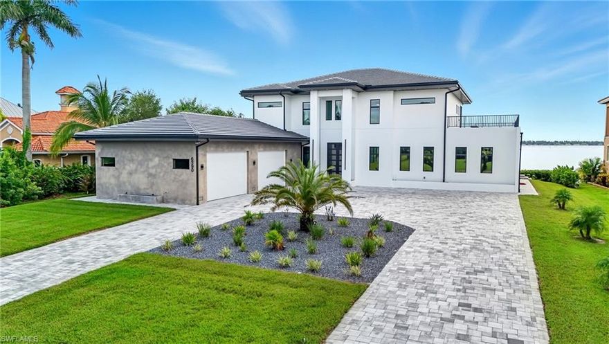 A Rare Waterfront Gem in North Fort Myers!

Tucked away in the exclusive River Club community, this brand-new 2024 estate captures the essence of Southwest Florida living with direct water views, a southeastern exposure, and a design crafted by a renowned German builder known for precision and quality.

This two-story residence welcomes you with a bright, open floor plan that flows seamlessly to the outdoors, where walls of glass frame the river and bring in both spectacular sunrise and glowing sunset views. With an oversized four-car garage — complete with a car lift for additional parking — this home blends everyday functionality with luxurious details throughout.

This home encompasses a total area of 8,582 sq. ft., complemented by a spacious 4-car garage, inviting entry, covered lanai, and expansive balcony, as measured by building plans.

Set on an oversized lot, the property offers exceptional outdoor living. A custom infinity-edge pool and spa with sun shelf and spillovers create a resort-like ambiance, all enclosed for year-round comfort. Two expansive roof terraces provide the perfect vantage point for cocktails at sunset or morning coffee overlooking the water.

For boating enthusiasts, the home is fully equipped with a 14,000-lb boat lift capable of handling vessels up to 30 feet and a 7,000-lb jet ski platform, making waterfront adventures effortless. Importantly, the property remained completely dry during recent storms, offering peace of mind along with its beauty.

Every aspect of this residence reflects thoughtful design, from its open, light-filled interiors to its elevated outdoor spaces. With craftsmanship you can feel and a lifestyle you’ll cherish, 6390 River Club Court is more than a home — it’s a true statement in modern Florida waterfront living.