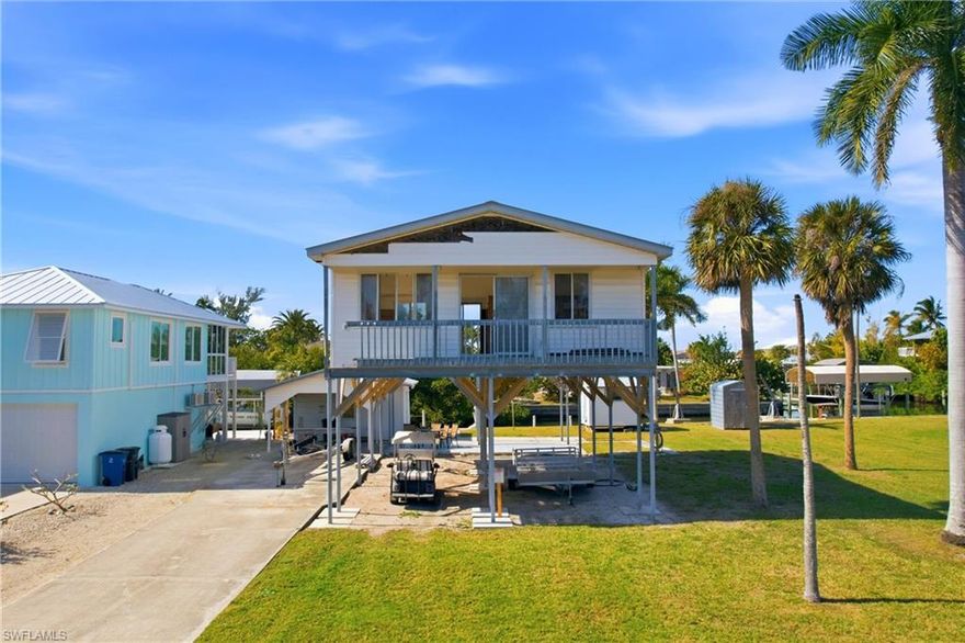 Exceptional waterfront lot-value opportunity in St. James City offering direct Gulf access with no bridges. This property features a concrete seawall, carport, and storage shed, making it ideal for redevelopment or a custom waterfront build.
The existing 2-bedroom, 1-bath structure (832 sq. ft. under air) was impacted by Hurricane Ian and has since been elevated above flood elevation. The home is currently uninhabitable and in unfinished condition, with framed walls and floor stringers in place but no installed flooring, providing flexibility for a full renovation or removal.
Located on a quiet street with immediate access to open water, this property is best suited for buyers seeking land value, redevelopment potential, or a ground-up new construction in a highly desirable Pine Island waterfront community.  The sellers have already completed significant upfront work and secured a permit along with architectural and construction plans, all of which can be conveyed to the Buyers. 
Cash buyers or renovation financing only. Sold AS-IS.