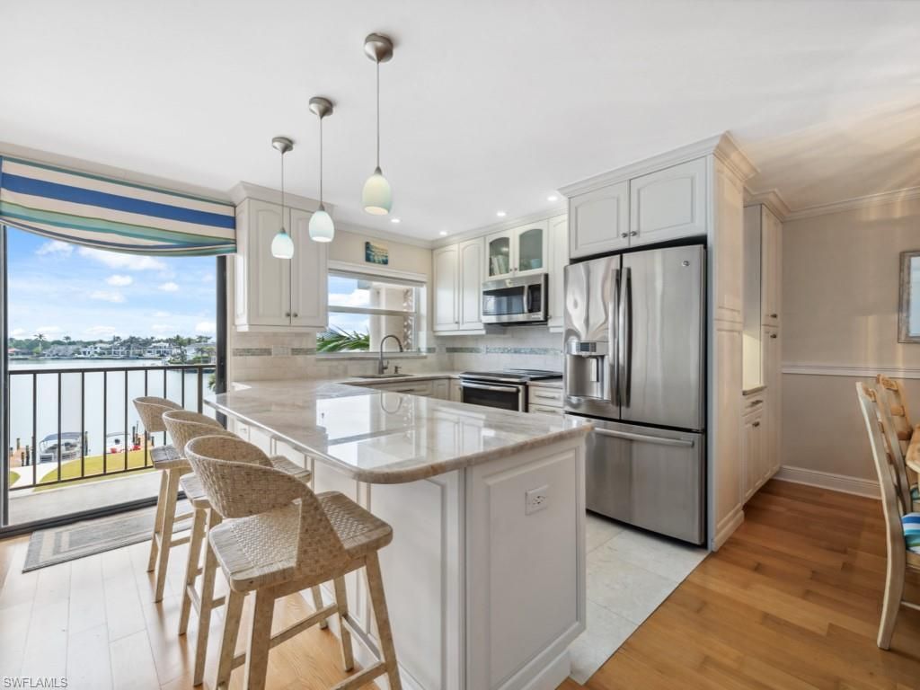 Photo of 3200 Gulf Shore BLVD N #407, NAPLES, FL 34103 (MLS # 225080193)