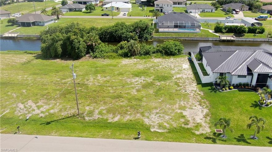 City water and sewer in! Build your dream home on this beautiful waterfront lot located at 1414 SW 1st St in Cape Coral. This 0.23-acre lot is fully cleared and ready for construction, saving you time and cost on site preparation. With desirable southern rear exposure, you’ll enjoy plenty of sunshine all year long—perfect for a future pool and outdoor living space. located on a peaceful canal, this property offers a great setting while still being conveniently close to shopping, dining, and everything Cape Coral and Pine Island Rd have to offer. Whether you’re ready to build now or looking for a smart investment, this lot checks all the boxes.