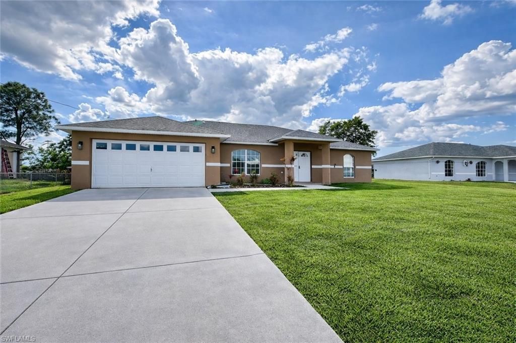 Photo of 528 Peerless CIR, LEHIGH ACRES, FL 33974 (MLS # 225083978)