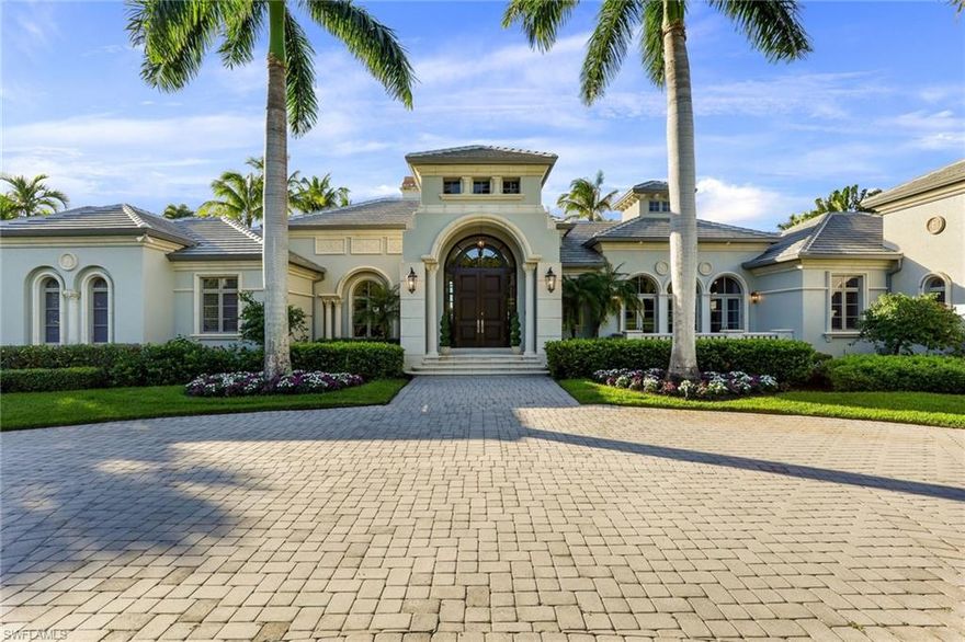 This custom estate home, on a significantly oversized lot, has undergone an extensive renovation.  Located in the prestigious Isle Toscano neighborhood of Grey Oaks, one of Florida’s most unique exclusive private residential communities, on one of its most charming streets and in close proximity to the renowned amenities of Grey Oaks Country Club this 6,300 square foot home with incredible water and golf course views, lives all on one level. Perfect for entertaining, numerous sliding glass doors lead out to a spacious lanai and pool area allowing the interior living spaces to blend harmoniously with exterior spaces and the surrounding vegetation. The great room concept, with separate formal living and dining rooms, boasts a chef's kitchen with a 6-burner Viking cooktop, oversized Sub-Zero refrigerator, beverage drawers, wall oven, warming drawer, and two islands. With soaring ceilings throughout, this 4 bedroom, 6 bathroom home also features a library, wet bar, dual-sided fireplace, breakfast nook, a bonus room currently used as one of the bedrooms, a generator, and electric lanai shutters. This is luxurious Grey Oaks living at it's best. A must-see home that will not last long.
