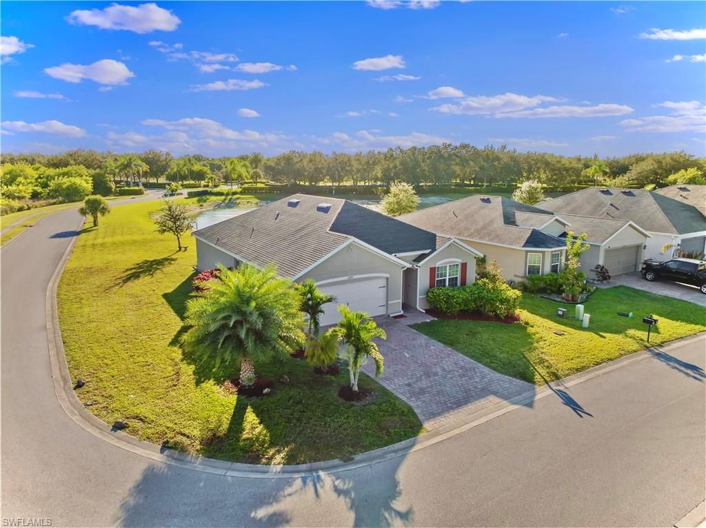Photo of 10285 Silver Pond LN, LEHIGH ACRES, FL 33936 (MLS # 2025018297)