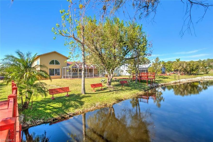 PARADISE FOUND! Vacation where you live at this beautiful Florida home, equipt with its own LAKESIDE PARK! Stunning, and peaceful, this waterfront property has the only private island in the community. Fish, bird watch, or feed the turtles from your private dock or double arched bridge. This charming residence has a sunny disposition, with soaring ceilings and natural light. Two story ceilings in the living room, gorgeous staircase to guest suites, and first floor master suite has sliders to pool/lanai. Nestled in Kings Bay Estates, this unique property offers the country charm of "Old Florida" while close proximity to shopping, dining, parks, and waterways. The neighborhood is one of the area's "best kept secrets", with the charm of individually styled homes and low HOA fees. Boats and trailers are welcome in this community. Bought in 2022, this home withstood a direct Category 5 hurricane hit and had NO interior flooding due to being one of the highest elevated properties in the area. Outdoor damage was minimal, and there was zero structural damage. Brand new aluminum metal roof, new AC, new front landscape and new pool filter. This is an ideal vacation home, or wonderful primary home for families. Call today to schedule your private showing.