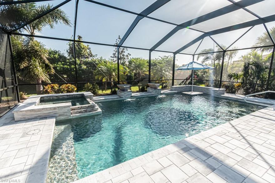 You want it all??  Here it is and it's just STUNNING. Highly desirable Islamorada model - 3 bedrooms, 3 baths plus den. This home is loaded with upgrades including;  Tile throughout, 5" base boards, 8' doors, crowns in every room, French doors in the den, Plantations shutters throughout the home, drop-down hurricane protection on the lanai, mounted lanai heaters, rimless shower doors, high-end fans and lighting, custom summer kitchen with grill and fridge, LG washer/dryer 2021,  HVAC 2022. and the POOL....Oh my - what a pool.  Nearly 2000 sq ft lanai with custom salt water pool/spa with  'swim table/seating'.  The high-end Frontgate lanai seating is available for sale.  See confidential notes.  Pelican Preserve is an active adult community offering a vast array of amenities; Golf, Tennis, Pickleball, Spa Services, Bocce, Theater, Hobby rooms, Library, Wood-working, indoor and out-door pools.  Golf is optional and memberships are available.