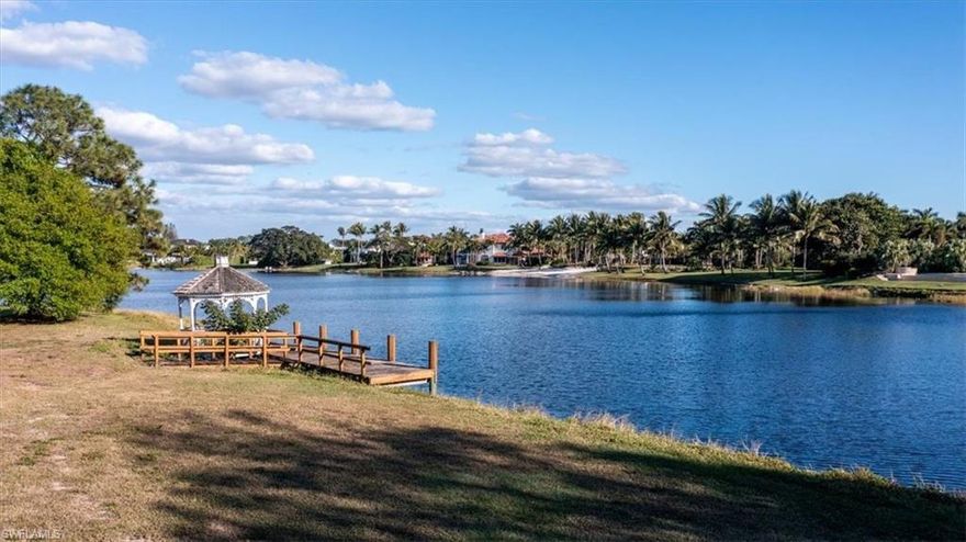 This spectacular 2 acre lake lot offers preferred southern exposure in the central section of Pine Ridge Estates. One of the last remaining of its kind, for the enthusiast wanting the space to construct a magnificent residence with water views and plenty of room for cars and toys in the existing air-conditioned garage that offers nearly 1,400 sq ft with over 13' ceiling height and four overhead doors. 269 concrete foundational piles have already been installed on site. Custom home design by MHK architecture and planning attached.
