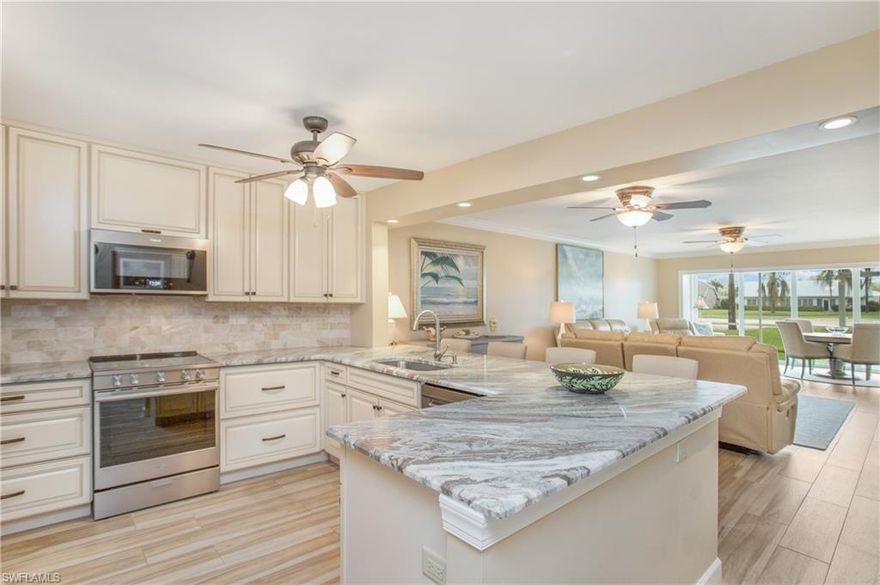 Welcome to an absolutely stunning wall to wall renovation that is superb in every detail complete with immediate full golf privileges located in the beautiful Cranbrook Colony subdivision of Royal Wood Golf & Country Club.  Over $100k was invested in the complete makeover of this first floor residence featuring two bedrooms and a spacious Den.  The Lanai has been enclosed and protected by storm rated sliding glass doors that add nearly 120 square feet to the air-conditioned space. The Cranbrook Colony subdivision of Royal Wood offers a park-like atmosphere complete with walking paths, Bocce ball, Tennis & Pickleball courts, along with a pool and clubhouse area. The Royal Wood County Club has just undergone a complete renovation featuring a redesigned open Clubhouse floor plan, a spacious Golf Pro shop, a state-of-the-art fitness center, along with a resort pool, tennis and pickleball courts.  The Golf course is a Michael Hurzdan designed 18 hole par 70 layout with 4 sets of tees offering challenges to Players of all levels.  Come visit this well located and superbly amenitized Community which is only a 20 minute drive from the Dining and Shopping areas of downtown Naples !!