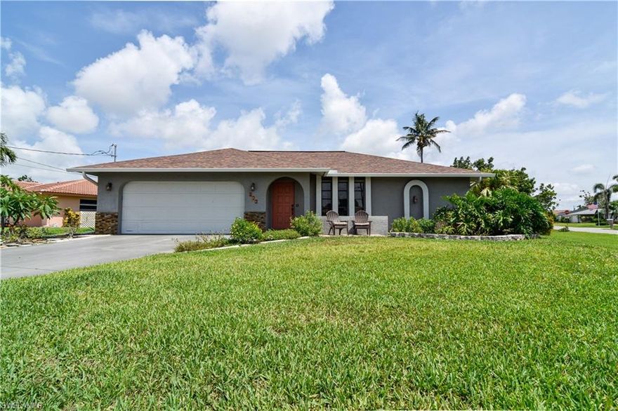 Nicely updated 3 bedroom, 2 bath, 2 car garage home located in central Cape Coral. Situated on a corner lot with a fenced-in backyard, this home offers plenty of privacy and space for outdoor activities and plenty of room to add a pool. The roof and AC were both replaced in 2020, and the electric was updated in 2016. Features of home include, large kitchen and dining area, living room, split bedroom floor plan, tile floors throughout, accordion shutters and side entry door in garage. All assessments are in and paid. Schedule your showing today and start living the Florida dream!