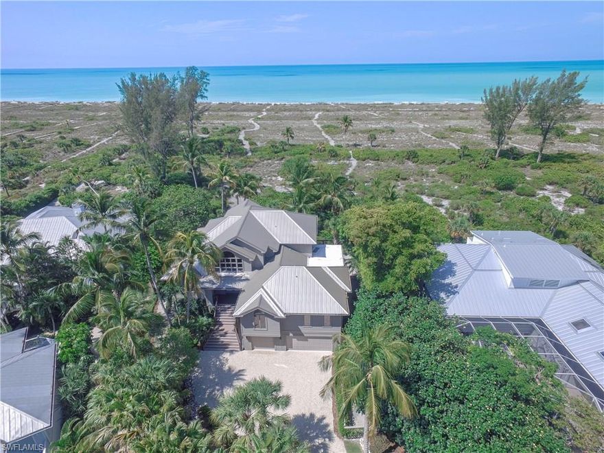 Located within the Gulf Ridge Community is this stunning Gulf Front estate home featuring 6 BR plus Den & 4.5 BTH, with endless panoramic views of sparkling Gulf waters and sunset skies, this meticulously maintained home offers all the space needed for privacy and tranquility. Enjoy oversized rooms and spaces for entertaining with open/screened lanais, large family room, lush tropical surroundings and private winding path to one of the Sanibel’s most beautiful beaches. 2nd floor master retreat features a cathedral ceiling and private deck to enjoy the tropical views. Additional spacious guest suite and BTH on this level. Main living level has a guest master suite w/ open deck and stunning gulf views. Separate guest area w/ 3 BR & BTH offers total privacy for your guests. Formal dining room overlooks the sparkling Gulf waters and large kitchen nearby are just a few more unbelievable aspects of this magnificent home. Enjoy the community pool with tennis court just steps from your door.