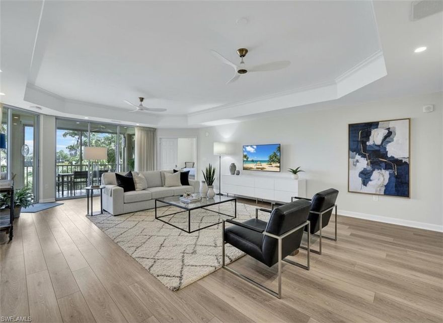 Buyers that are looking to step right into the exclusive Audubon Country Club lifestyle without delay—this Montclair condominium is the perfect fit. Social life begins the moment you arrive, and golf is ready when you are.  This spacious 3-bedroom, 3.5-bath residence lives like a single-family home, offering nearly 2,600 square feet of air-conditioned living space and over 2,900 square feet in total. Ideally located just steps from the pool and clubhouse, this second-floor end unit features a wraparound lanai with sweeping golf course, lake, and sunset views.  Move-in ready with neutral décor, wide luxury vinyl plank flooring, and a modernized layout that includes both formal and casual Living and Dining areas, a Den, a Powder Room, and a Laundry Room. The Kitchen has been thoughtfully updated with Quartzite countertops, professionally painted oak cabinetry, and newer stainless appliances, including an LG microwave and dishwasher. All Bathrooms have been redone, and each Bedroom offers an Ensuite layout with custom closets and updated lighting. The generous Primary Suite includes a walk-in closet plus an additional glassed-in custom wardrobe system, along with a spacious Bath finished in travertine, a large shower, and a dual-sink granite vanity.  From 2022 to 2025, this unit has been comprehensively refreshed with new ceiling fans, LED lighting, switches, plugs, UV window film, and updated hardware. The lanai features newer remote-controlled electric storm shutters for effortless lock-and-leave living. Additional upgrades include a new air handler and water heater, a whole-home surge protector, an in-duct Reme-Halo air purifier, and professionally cleaned ductwork.  An oversized Two-Car Garage provides abundant storage, bright LED lighting, fresh paint, and space to charge a golf cart.   Montclair at Audubon is an intimate 36-residence enclave known for private garage parking and open floor plans that offer the comfort of a single-family home with low-maintenance convenience. Audubon Country Club delivers a premier lifestyle west of US41, minutes from beaches, dining, and shopping. Amenities include a new lifestyle center with expanded fitness and outdoor dining, tennis, bocce, pickleball, croquet, and a championship 18-hole Joe Lee-designed golf course set amid 770 acres of natural preserves and lakes. A scenic boardwalk and kayak launch connect you to the back bay waters—ideal for nature lovers.  A Social or Golf (In Waiting) membership is required, and both provide immediate access to the vibrant, active lifestyle Audubon is known for.  This is a rare opportunity to enjoy refined condo living in an amenity-rich, exclusive country club community.