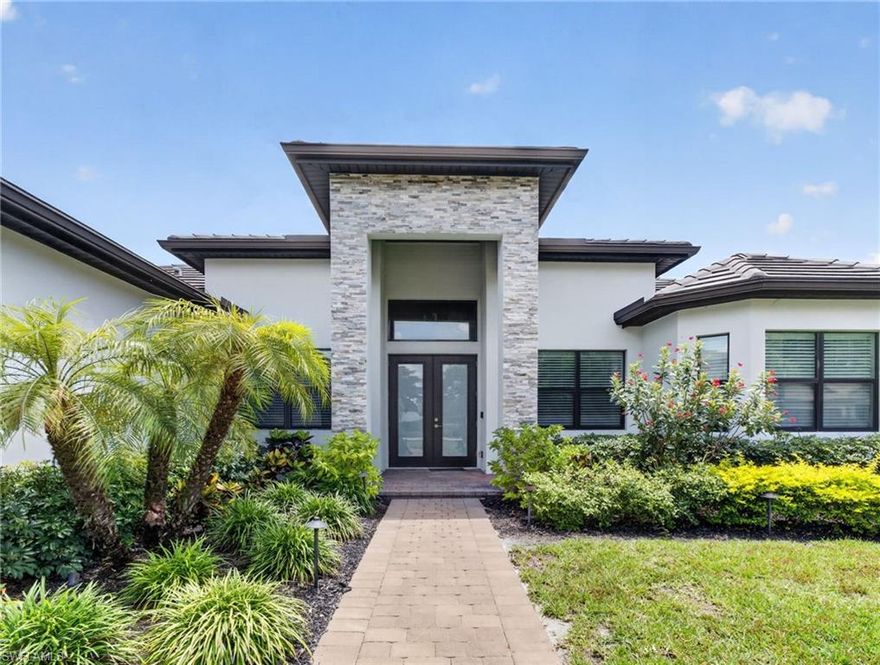 Stunning newer construction home built in 2021 offering the perfect blend of luxury, style, and comfort. This beautifully designed residence features 3 spacious bedrooms plus a private office/den, 3 full bathrooms and an additional half bath. From the moment you enter, you’ll appreciate the soaring tray ceilings, open-concept floor plan, and elegant finishes throughout.

The gourmet kitchen is a showstopper with sleek custom cabinetry, oversized island seating, designer lighting, and beautiful countertops that flow seamlessly into the expansive living and dining areas — perfect for entertaining. Rich tile flooring throughout the home adds warmth and sophistication.

The luxurious primary suite offers a spa-inspired bath complete with an oversized walk-in shower featuring dual shower heads, a relaxing soaking tub, and spacious walk-in closets.

Step outside to your own private paradise with lush tropical landscaping, gorgeous flowers, and a beautifully designed outdoor space ideal for relaxing or entertaining. The striking modern elevation, paver driveway, and impressive entry create incredible curb appeal.

This home combines modern elegance with the Florida lifestyle buyers are looking for — close to boating, beaches, dining, and everything Southwest Florida has to offer.