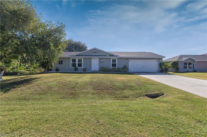 Here's your chance to own a piece of Paradise at a great price! This hidden gem is tucked away in a beautiful quiet neighborhood. The roof was replaced in 2018, windows were replaced in 2018 with impact glass, as well as glass slider, front door and garage door. Other important upgrades include a newer AC unit and hot water installed. Additional features are recently remodeled bathrooms, updated lighting and tile throughout. Step outside onto your private deck soaking up the SWFL sun. The home sits on an over-sized lot that has been transformed into your very own personal oasis. Your yard is filled with several large trees to shade you from our hot summers. If you are looking for a quiet retreat than look no further. Whether you are looking for year round or seasonal this is a great option! Come and enjoy our Southwest Florida lifestyle. Call for your own private showing today!